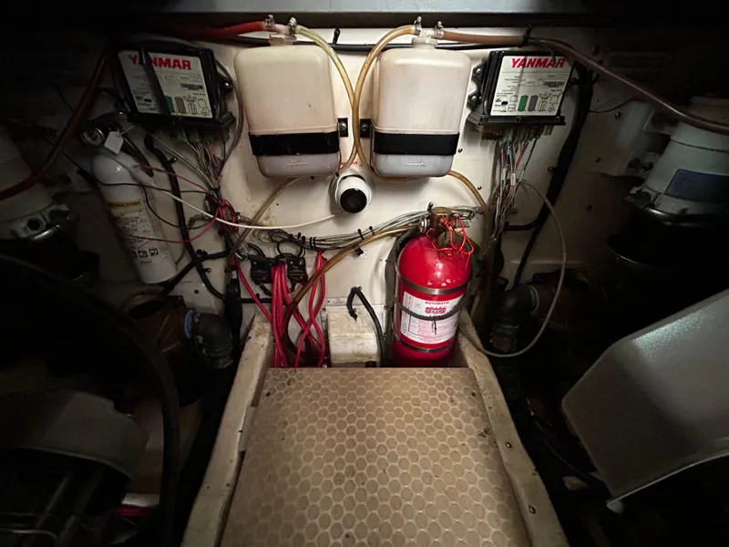 Slide: The Image of Engine room of 2007 Luhrs 36 Convertible with Yanmar components and fire extinguisher. - 22