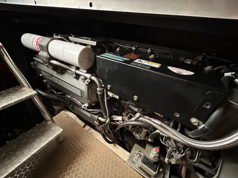 Slide: The Image of Engine compartment of a 2007 Luhrs 36 Convertible boat, showcasing mechanical components. - 23