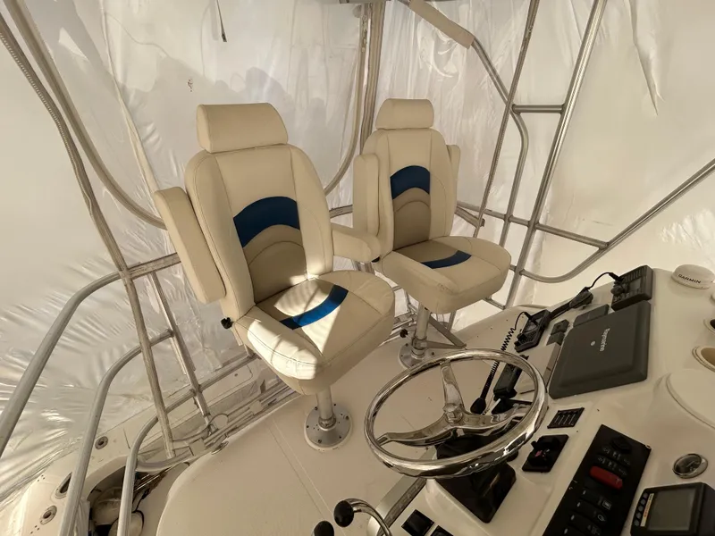 Slide: The Image of 2007 Luhrs 36 Convertible helm with dual seats and navigation equipment. - 3