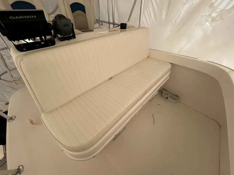Slide: The Image of 2007 Luhrs 36 Convertible boat interior with white seating and Garmin equipment. - 7