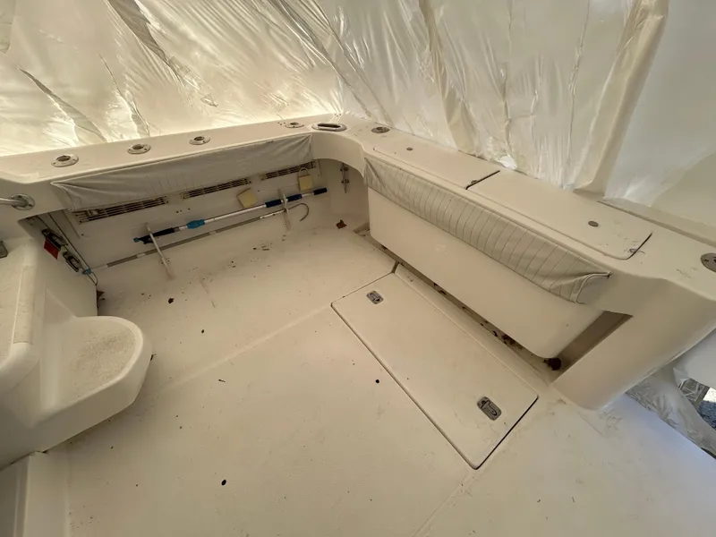 Slide: The Image of 2007 Luhrs 36 Convertible boat interior with storage compartments and seating. - 9