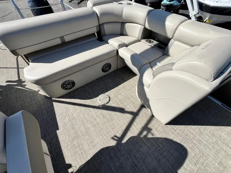 Slide: The Image of 2020 Harris FloteBote Cruiser 230 interior with beige seating and carpeted flooring. - 18