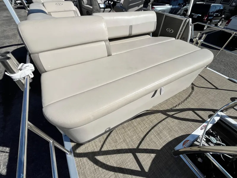 Slide: The Image of 2020 Harris FloteBote Cruiser 230 boat seating area with beige upholstery. - 28