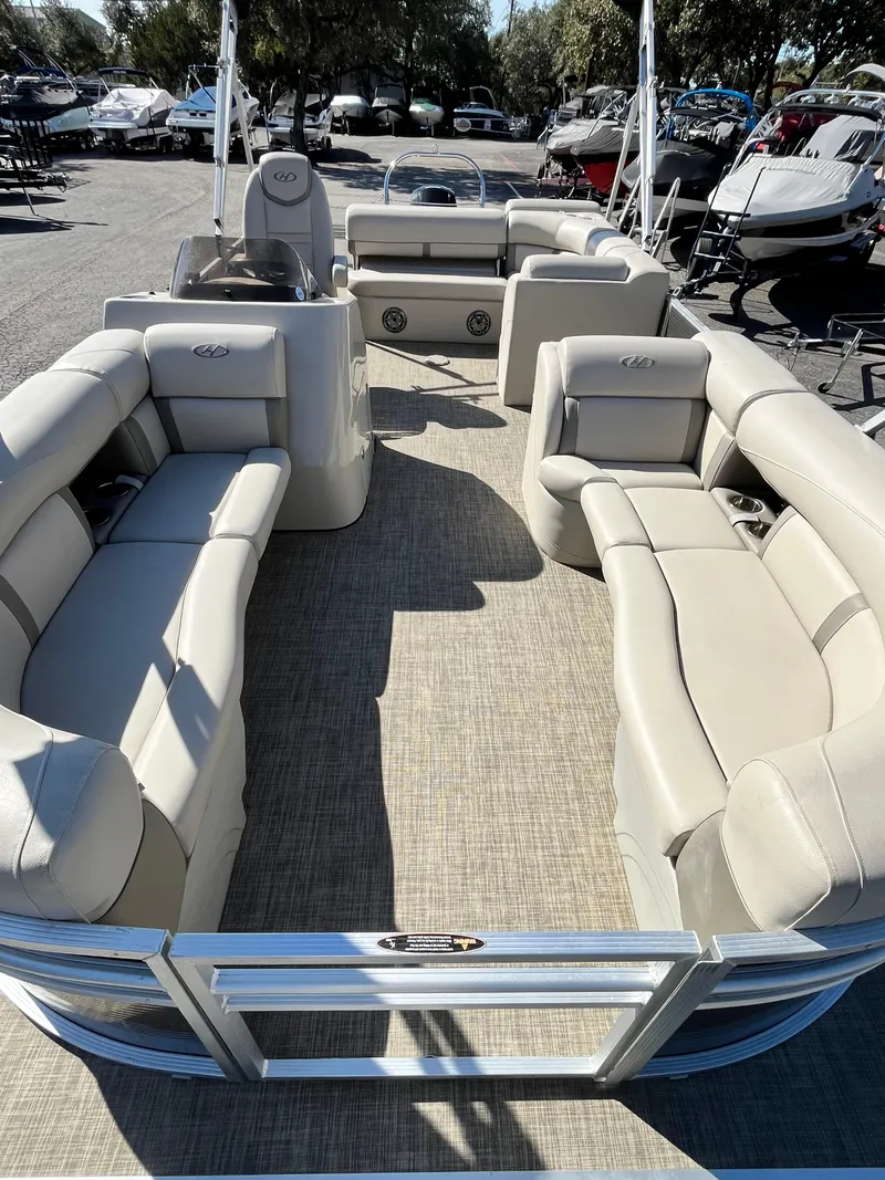 Slide: The Image of 2020 Harris FloteBote Cruiser 230 pontoon boat with spacious seating and modern design. - 4