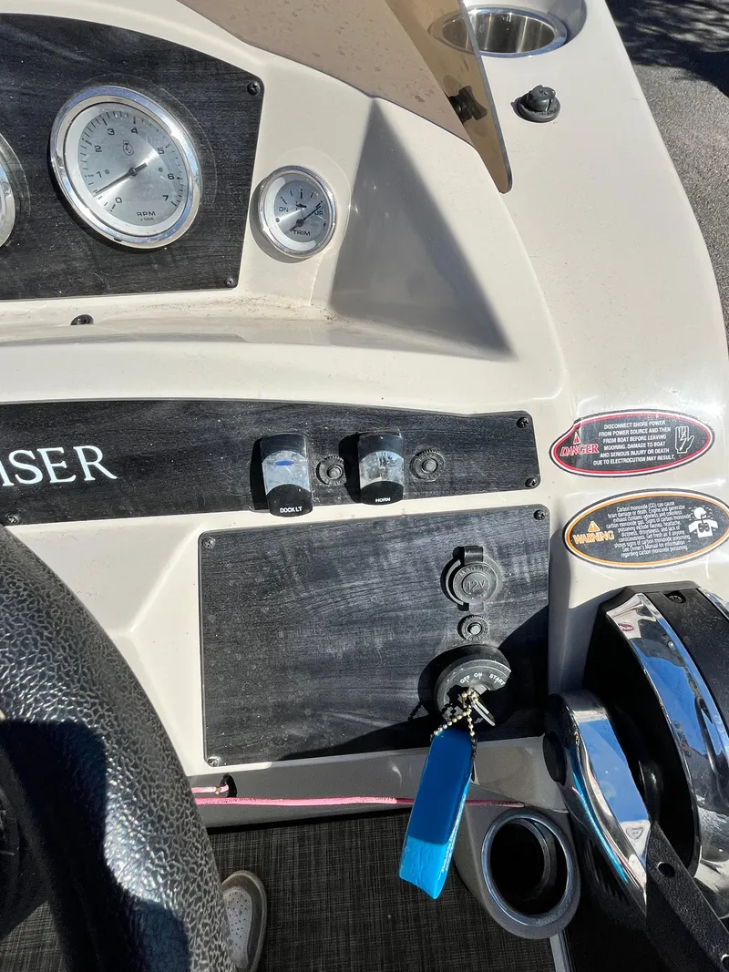Slide: The Image of Control panel of a 2020 Harris FloteBote Cruiser 230 with gauges and ignition key. - 7