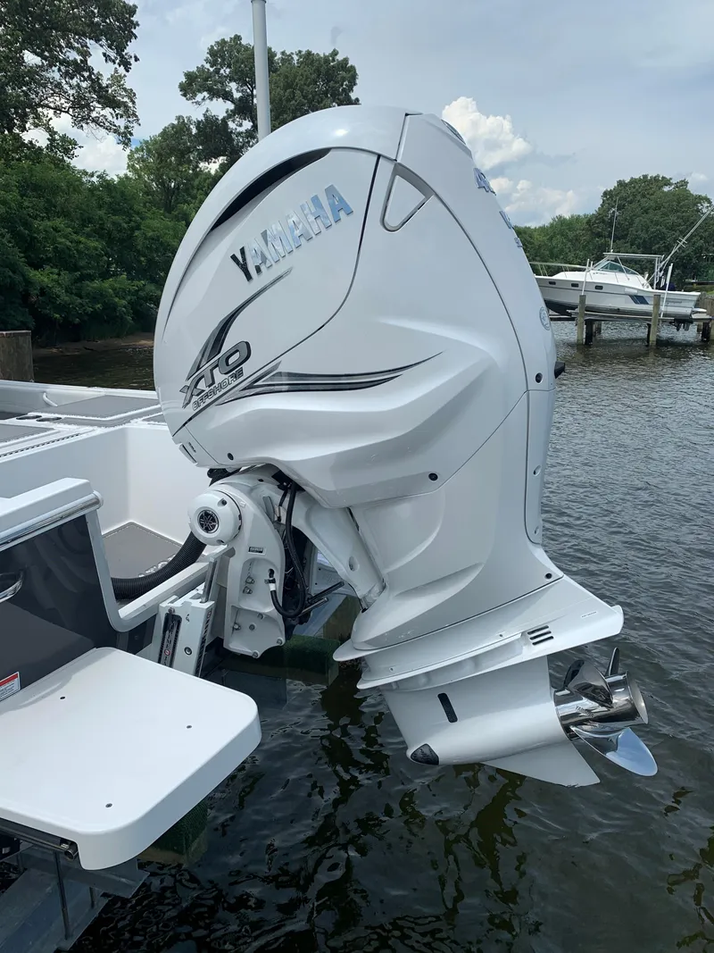 Slide: The Image of 2021 Regulator 26XO boat with Yamaha outboard motor on water. - 10