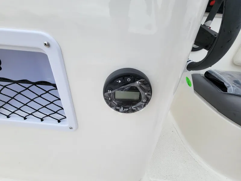 Slide: The Image of 2025 Bayliner Element E18 dashboard with control panel and storage net. - 13