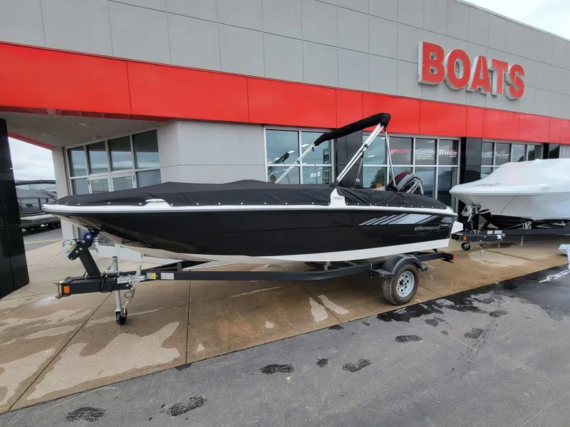 Slide: The Image of 2025 Bayliner Element E18 boat on trailer outside dealership. - 4
