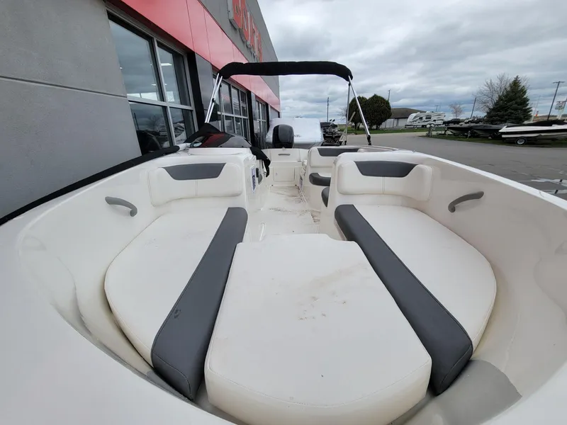Slide: The Image of 2025 Bayliner Element E18 boat interior with spacious seating and modern design. - 6