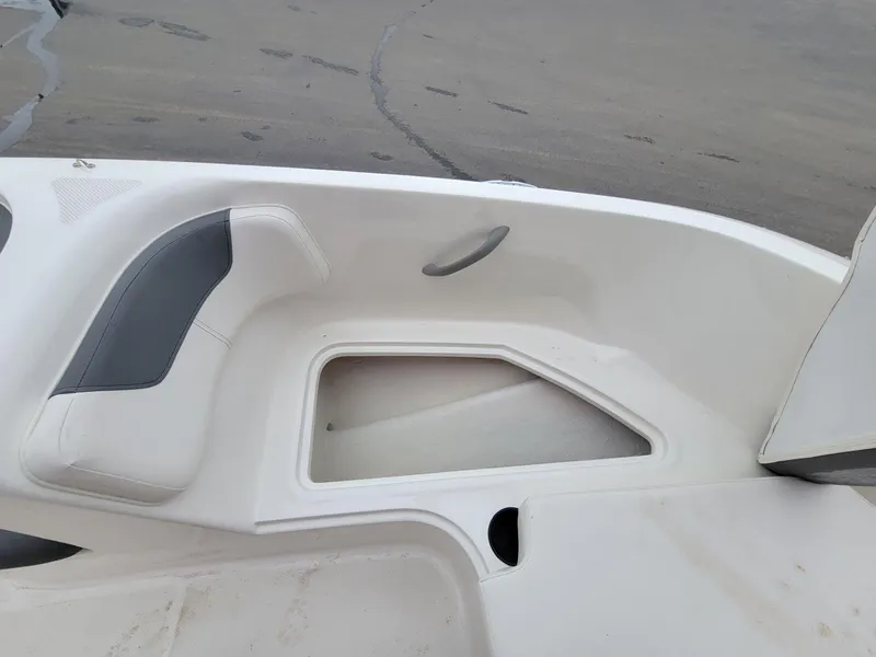 Slide: The Image of 2025 Bayliner Element E18 boat interior seating and storage compartment. - 7
