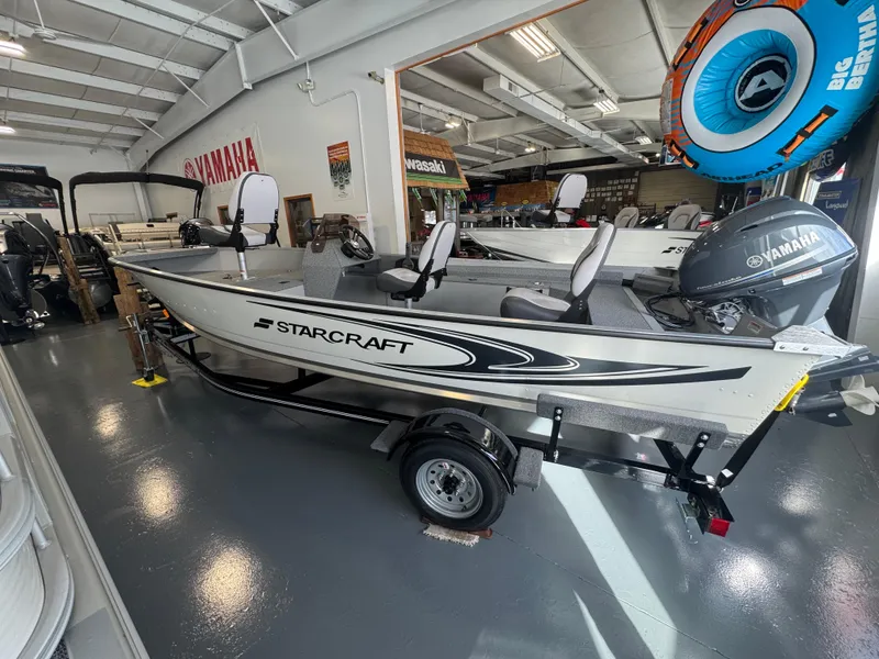 Slide: The Image of 2025 Starcraft Patriot 16 SC boat with Yamaha motor in showroom. - 3