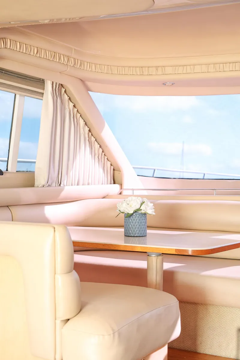 Slide: The Image of Luxurious interior of 2000 Sea Ray 480 Sedan Bridge yacht with elegant seating. - 11