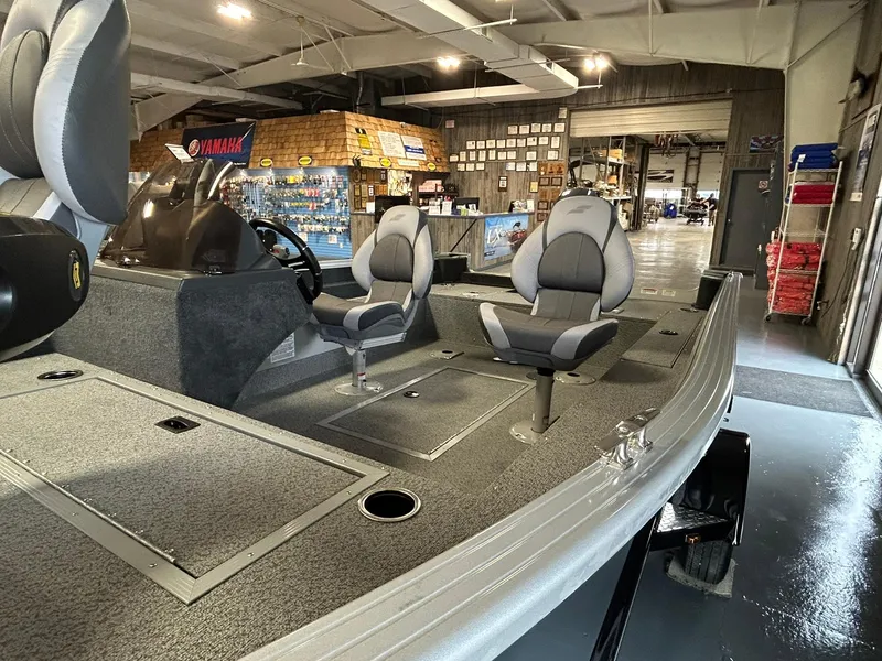 Slide: The Image of 2025 Starcraft Stealth 166SC boat interior with seating in a showroom. - 4