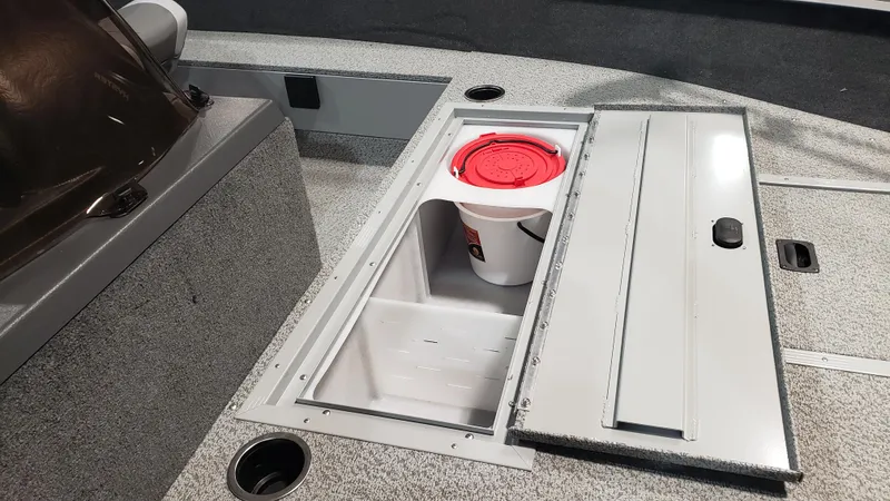 Slide: The Image of Starcraft Stealth 166SC 2025 boat storage compartment with bucket and sliding cover. - 5