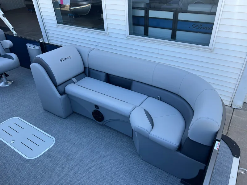 Slide: The Image of 2025 Bentley Pontoons Legacy 243 Navigator with luxurious gray seating. - 12