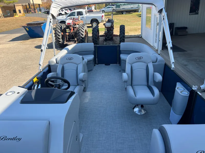Slide: The Image of 2025 Bentley Pontoons Legacy 243 Navigator interior with plush seating and modern design. - 13