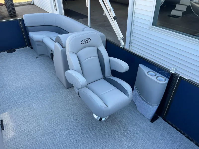 Slide: The Image of 2025 Bentley Pontoons Legacy 243 Navigator interior with luxurious seating and cup holders. - 15