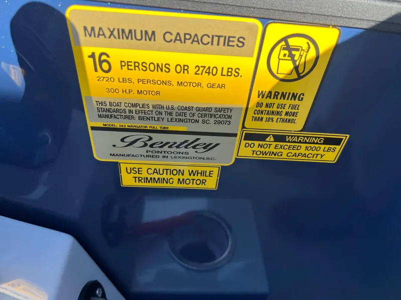 Slide: The Image of Bentley Pontoons Legacy 243 Navigator 2025 capacity label, 16 persons or 2740 lbs, safety warnings. - 19