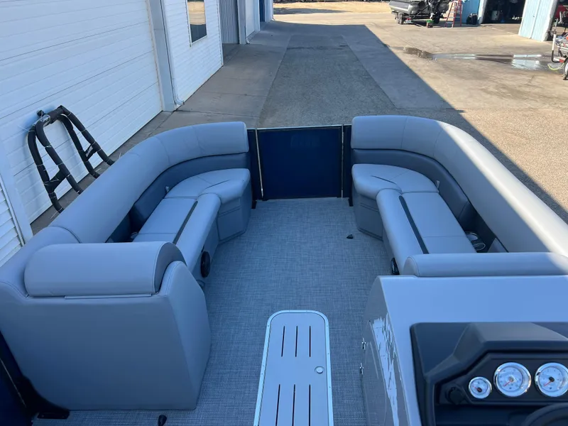 Slide: The Image of 2025 Bentley Pontoons Legacy 243 Navigator interior with gray seating and modern dashboard. - 8