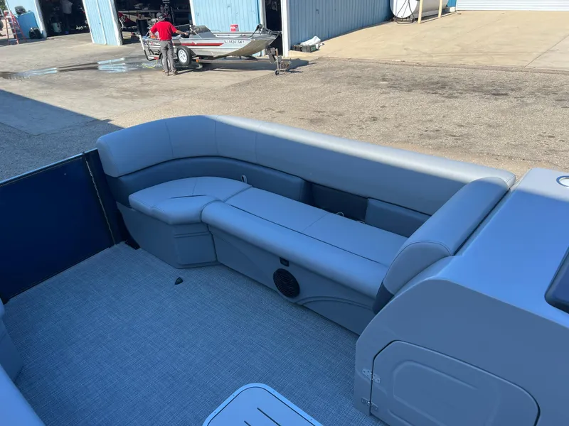 Slide: The Image of 2025 Bentley Pontoons Legacy 243 Navigator interior with gray seating and spacious layout. - 9