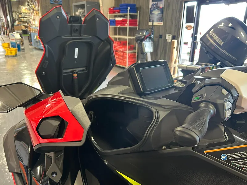 Slide: The Image of 2025 Kawasaki Jetski Ultra 310X dashboard and controls in a showroom. - 4