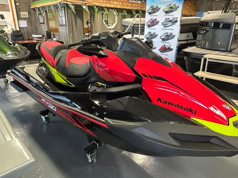Slide: The Image of 2025 Kawasaki Jetski Ultra 310X in showroom, featuring sleek red and black design. - 6