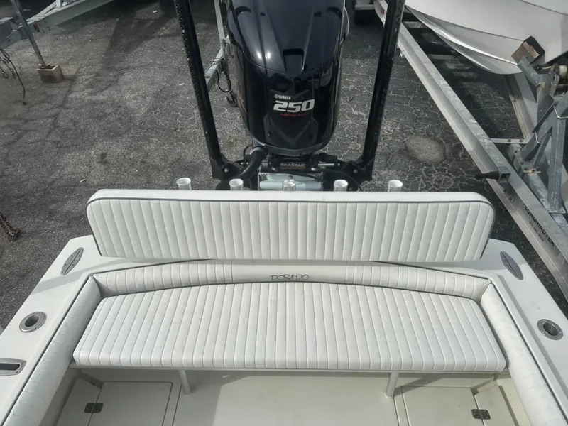 Slide: The Image of 2008 Dorado 23 Classic boat with Yamaha 250 engine, featuring white cushioned seating. - 14