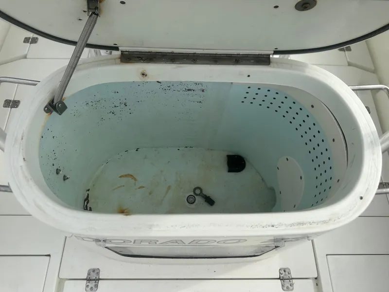 Slide: The Image of Open storage compartment on 2008 Dorado 23 Classic boat. - 16