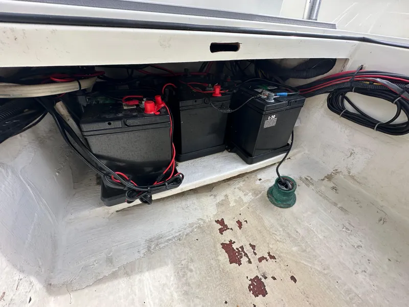 Slide: The Image of Battery compartment of 2008 Dorado 23 Classic boat with wiring and connections. - 18