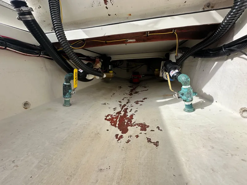 Slide: The Image of 2008 Dorado 23 Classic boat interior showing pipes and wiring. - 19