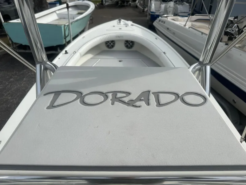 Slide: The Image of 2008 Dorado 23 Classic boat, white interior, docked among other boats. - 21