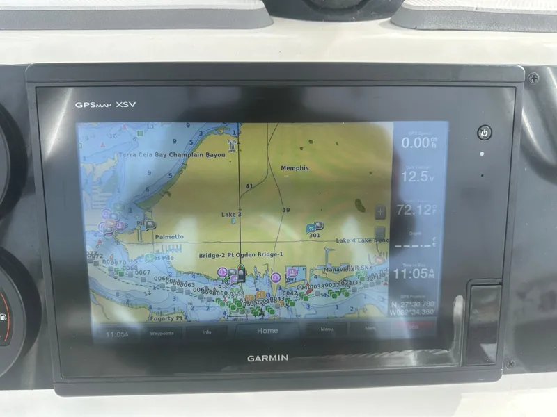 Slide: The Image of Garmin GPS display on 2008 Dorado 23 Classic boat, showing navigation map. - 24