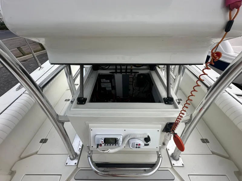 Slide: The Image of 2008 Dorado 23 Classic boat console with open storage compartment and control panel. - 30