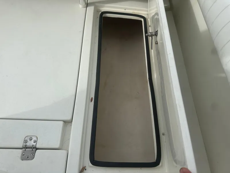 Slide: The Image of Open storage compartment on a 2008 Dorado 23 Classic boat. - 31