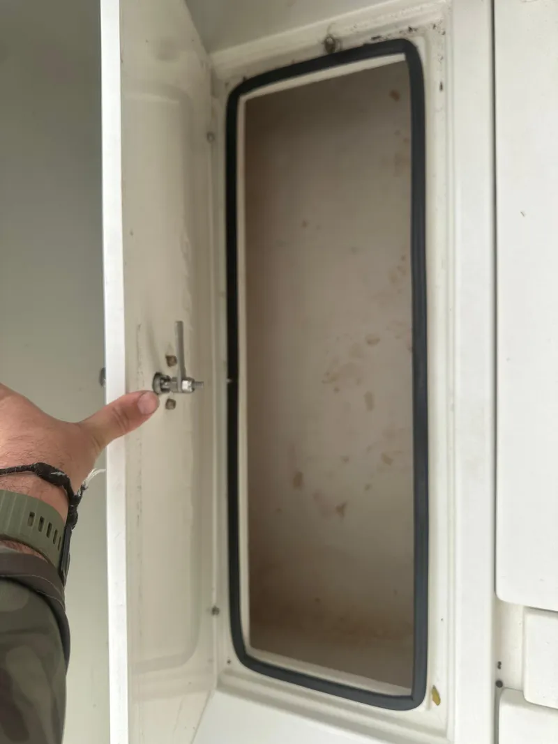 Slide: The Image of Open storage compartment on a 2008 Dorado 23 Classic boat. - 32