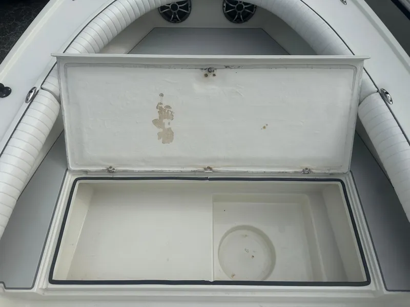 Slide: The Image of Open storage compartment on 2008 Dorado 23 Classic boat, featuring white interior. - 37
