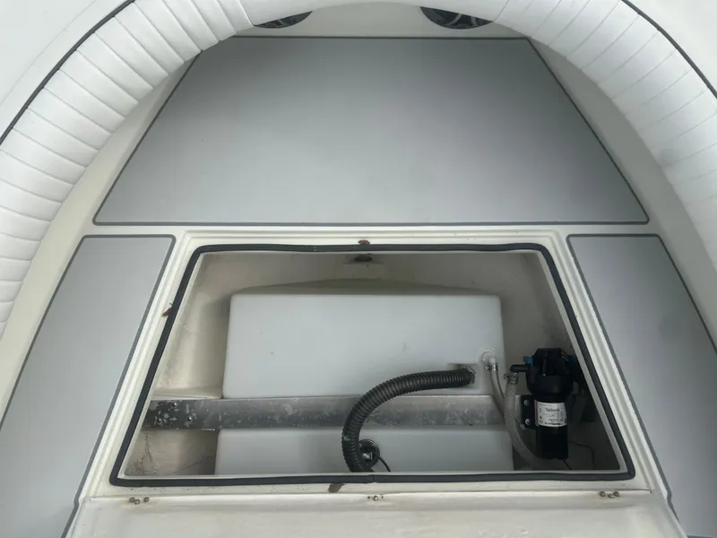 Slide: The Image of 2008 Dorado 23 Classic boat interior storage compartment with pump system. - 38