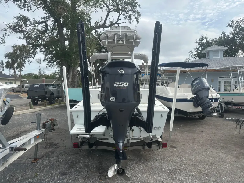 Slide: The Image of 2008 Dorado 23 Classic boat with 250 HP engine, parked in a marina. - 5