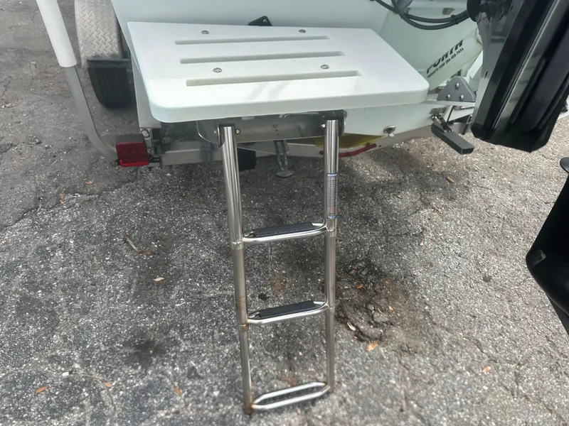 Slide: The Image of 2008 Dorado 23 Classic boat with a foldable ladder and swim platform. - 7