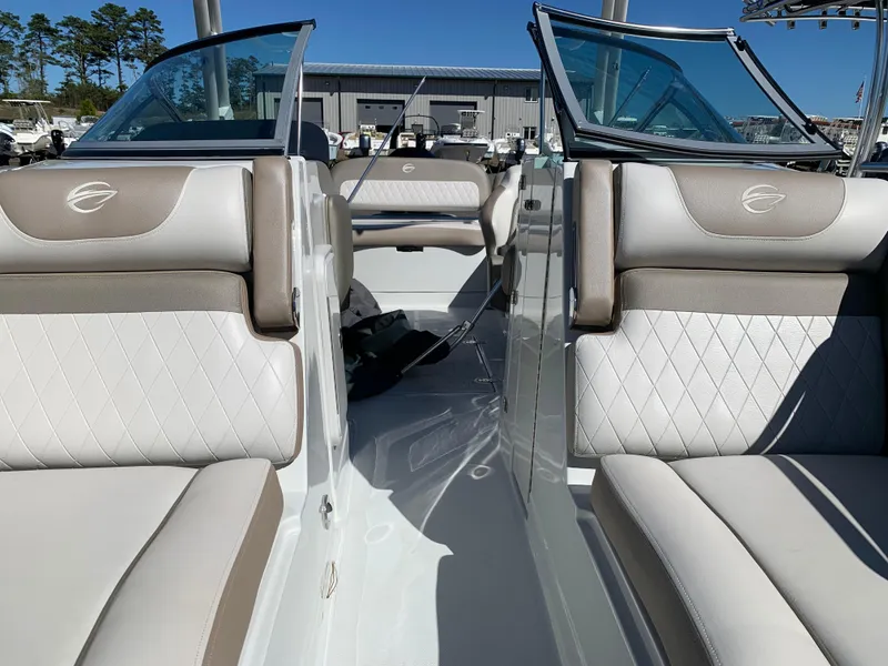 Slide: The Image of 2023 Crownline E235XS boat interior with luxurious seating and modern design. - 13