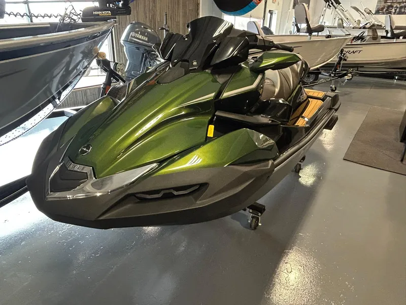 The Image of 2025 Kawasaki JET SKI ULTRA 160LX in showroom, sleek green design, side view. - 0