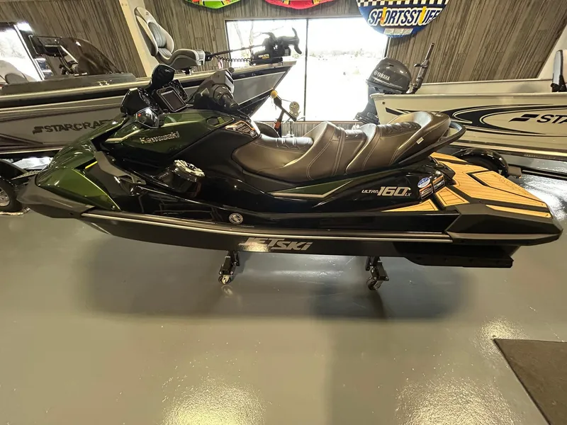 Slide: The Image of 2025 Kawasaki JET SKI ULTRA 160LX in showroom, side view. - 2