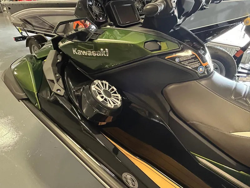 Slide: The Image of 2025 Kawasaki JET SKI ULTRA 160LX in showroom, featuring sleek design and advanced controls. - 5