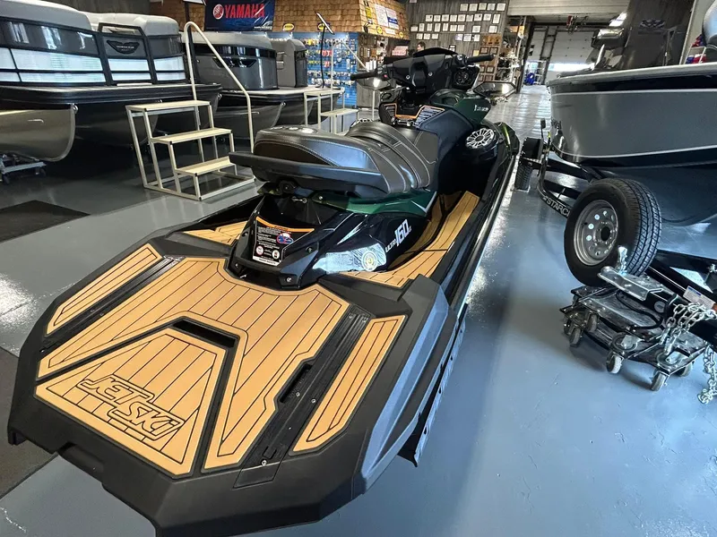 Slide: The Image of 2025 Kawasaki JET SKI ULTRA 160LX in showroom, featuring sleek design and wood-style deck. - 8