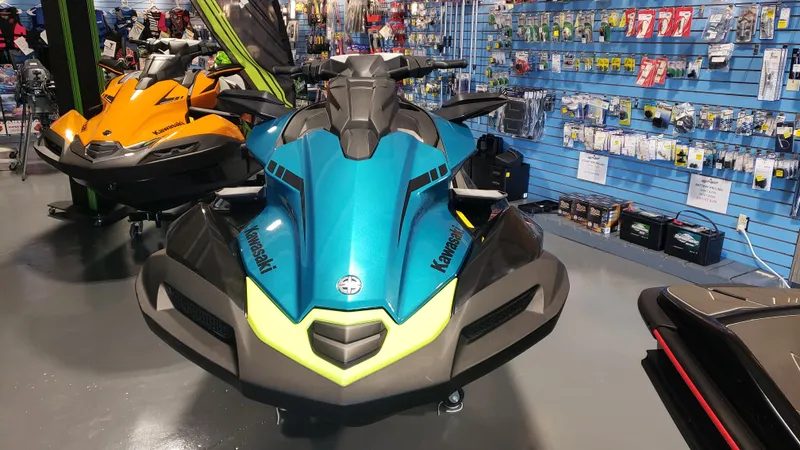 Slide: The Image of 2023 Kawasaki Jetski Ultra 310X displayed in a showroom with accessories. - 3