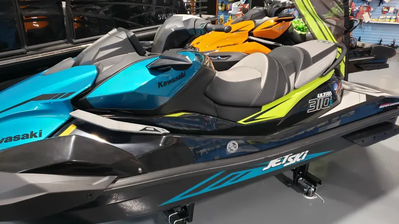 Slide: The Image of 2023 Kawasaki Jetski Ultra 310X in showroom, featuring sleek design and vibrant colors. - 5