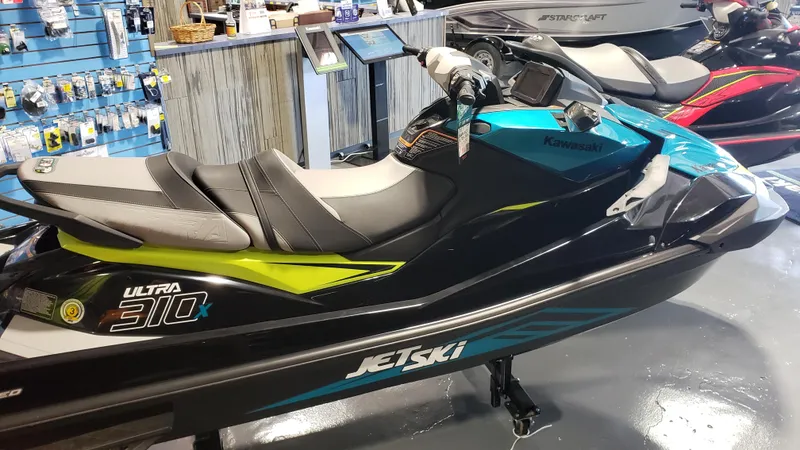 Slide: The Image of 2023 Kawasaki Jetski Ultra 310X in showroom, featuring sleek design and vibrant colors. - 6
