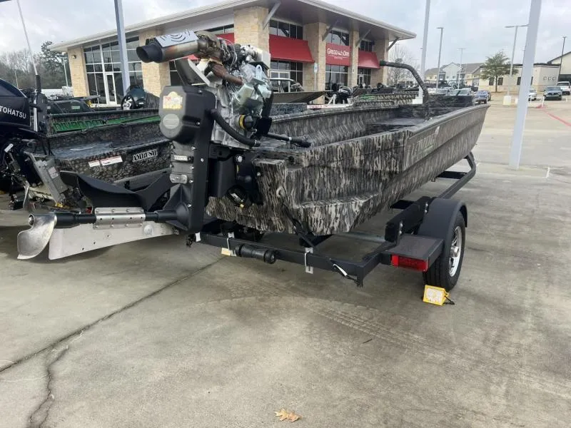 Slide: The Image of 2024 Havoc Boats 1750 MSTC LIMITED EDITION on trailer, camo design, outdoor dealership. - 5