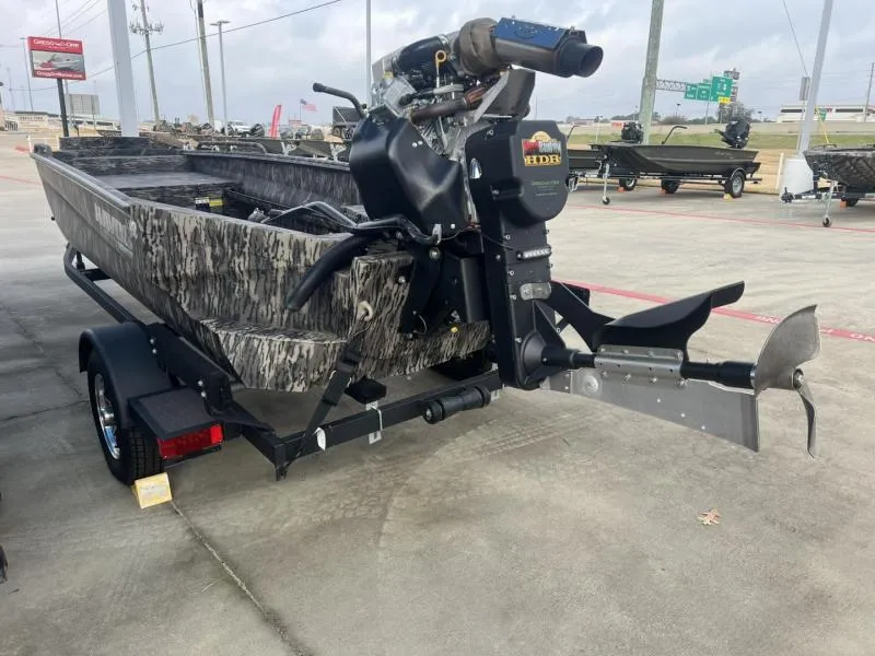 Slide: The Image of 2024 Havoc Boats 1750 MSTC LIMITED EDITION on trailer, featuring camouflage design and powerful motor. - 7