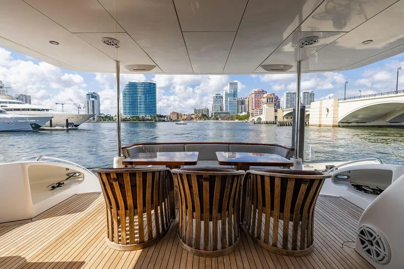 Slide: The Image of Luxury Hatteras 80 Motor Yacht 2013 with elegant deck and city skyline view. - 15